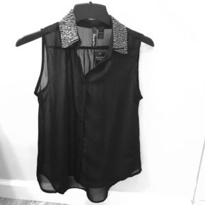 Black sheer tank top with silver-beaded collar.